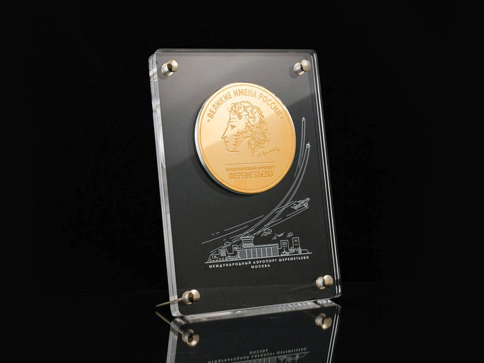 Corporate medal on an acrylic stand